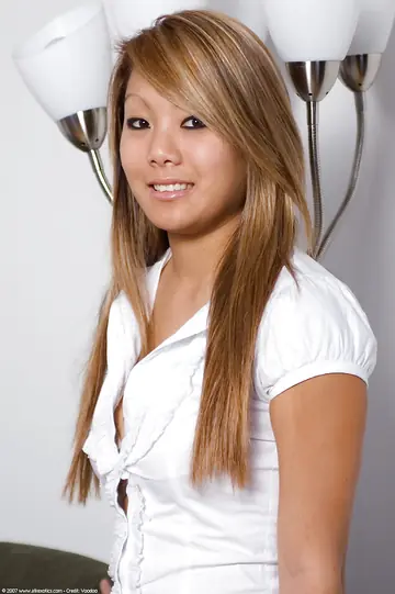 Blonde Asian Woman Removes Her Jeans and Spreads Her Shaved Pussy