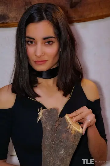 Solange – Tattooed Asian Brunette in Boots Pleasures Hairy Pussy with Fireplace Poker