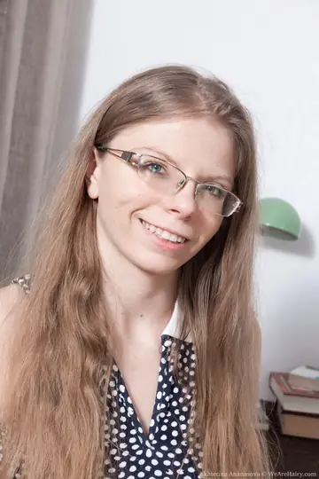 Blonde in Glasses and Skirt Spreads Her Hairy Pussy