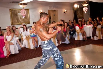 Tattooed Woman in Heels Gives a Blowjob at Interracial Party