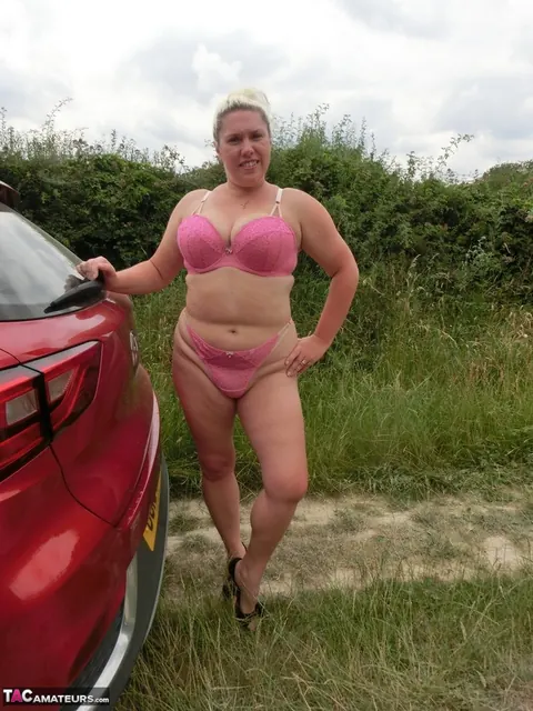 Blonde with Big Tits Poses in Lingerie and Stockings Outdoors – photo 4 of 16