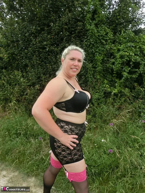 Blonde with Big Tits Poses in Lingerie and Stockings Outdoors – photo 15 of 16