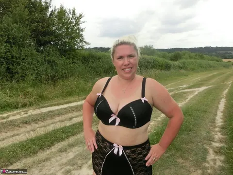 Blonde with Big Tits Poses in Lingerie and Stockings Outdoors – photo 13 of 16
