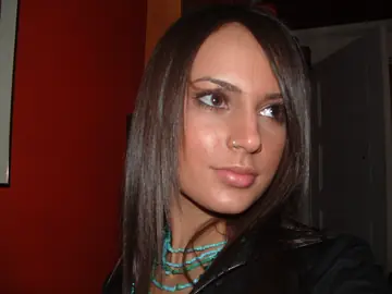Woman in a Bikini and Jeans Shows Her Pierced Nipples