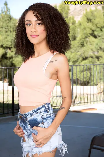 Slim Ebony Babe with Big Natural Tits Spreads Outdoors