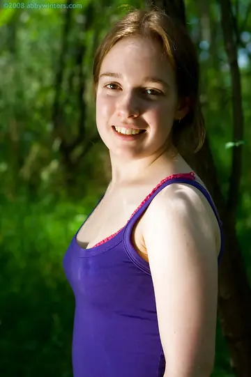 Busty Woman Strips Out of Her Shorts and Spreads Her Hairy Pussy in the Forest