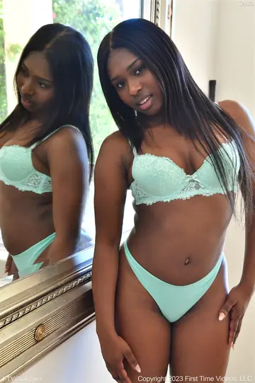Ebony Babe Strips and Masturbates Before a Mirror
