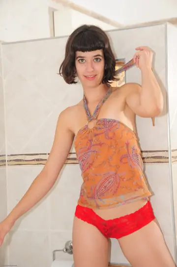 Short-Haired Brunette Strips Nude and Spreads Her Hairy Pussy