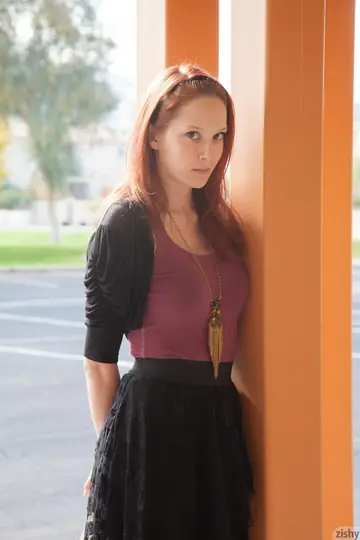 Petite Redhead Lifts Her Skirt to Show Purple Panties in the Hotel Lobby