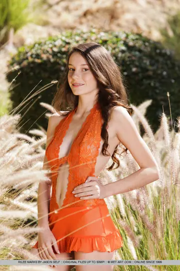 Skinny Brunette Squats and Spreads on Patio Stones