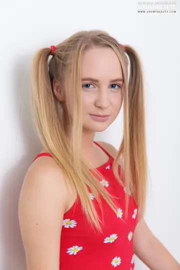 Blonde in Shorts Spreads with Long Pigtails