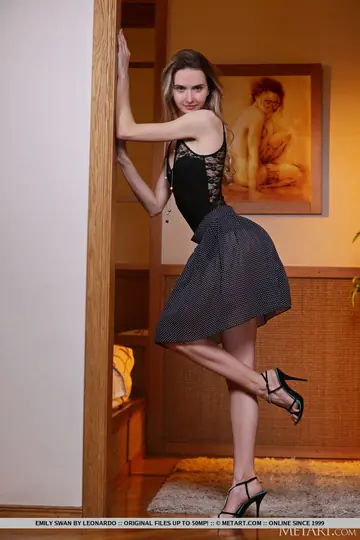 Emily Swan – Slim Blonde Strips Out of Her Skirt and Panties on a Chair