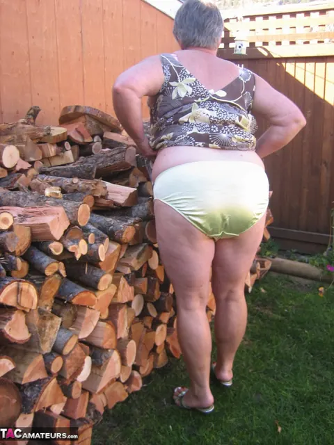 European BBW Strips by a Wood Pile Outdoors – photo 8 of 20