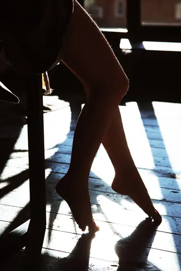 Woman Strips Nude and Poses to Show Her Figure