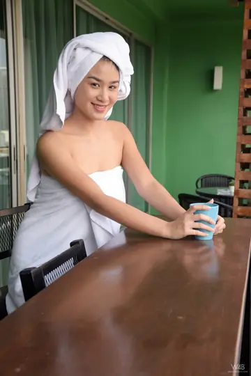 Kahlisa Boonyasak – Asian Brunette Oils Her Natural Tits and Hairy Pussy in the Kitchen