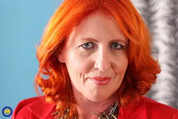 Redhead MILF Toys Her Trimmed Pussy in Stockings