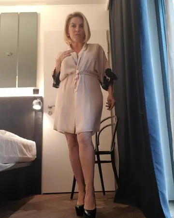 Blonde MILF with Big Tits Teases in Lingerie and Heels