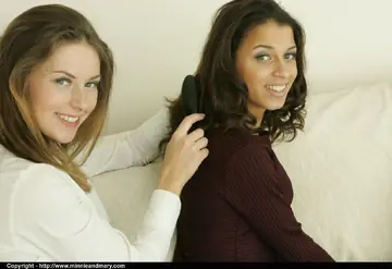 Two Women Kiss and Strip Out of Their Lingerie and Stockings