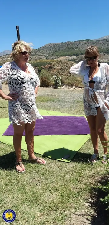 Mature Curvy Lesbians with Glasses Fuck with a Dildo Outdoors