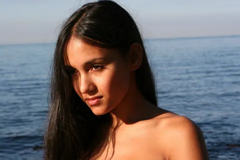 Busty Brunette Strips Nude on the Beach – photo 11 of 21