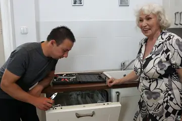 Short-Haired Mature Woman with Big Tits Gives a Handjob Then Fucks