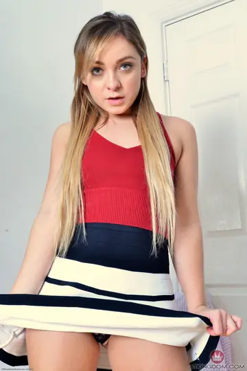 Blonde in a Skirt Strips and Spreads Her Shaved Pussy