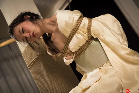 Asian Brunette Restrained with Rope in Shibari Session – photo 13 of 16