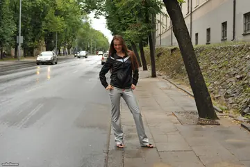 European Woman Poses Nude in a Public Outdoor Setting