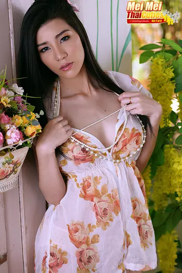 Asian Woman Removes Her Dress and Uses a Toy Outdoors