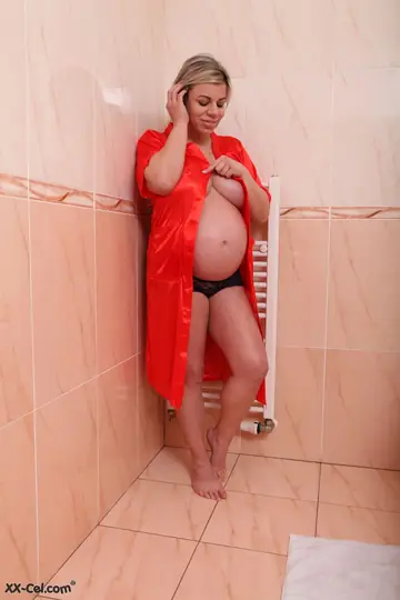 Thick Blonde Pregnant MILF Fingers Herself in the Bathroom