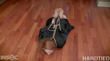 Ruby Red – Ebony Redhead Bound in Restraints Spreads Her Pussy