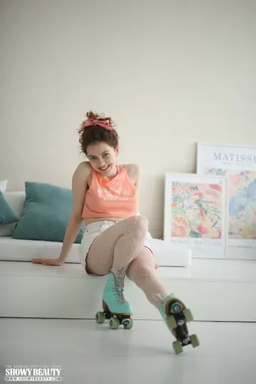 Woman Pulls Off Roller Skates and Strips Out of Her Shorts