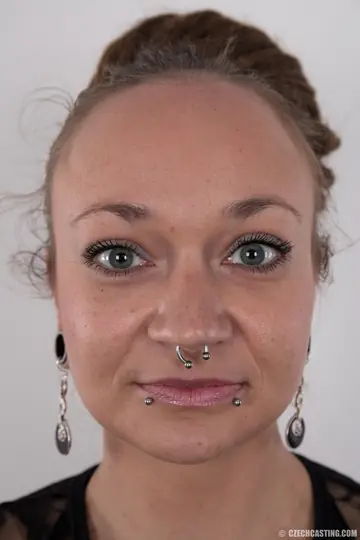 Czech Woman Undresses to Show Her Tattoos and Piercings